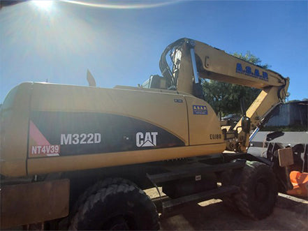 Yellow Caterpillar excavator with 'M322D' and 'NT4V39' heavy machinery for sale near corona ca by westrax machinery
