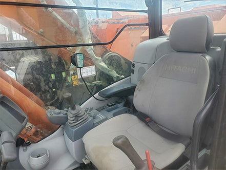 Operator's seat inside a Hitachi excavator heavy machinery for sale near corona ca by westrax machinery