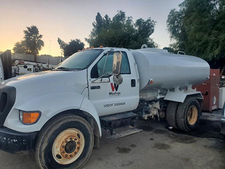 Side view of Ford F750 medium-duty commercial truck for sale near Corona CA at Westrax Machinery