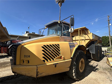 Yellow dump truck on a construction site heavy machinery for sale near Corona CA at Westrax Machinery
