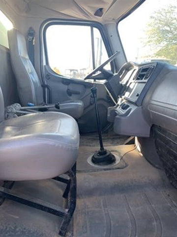 Interior of a vehicle showing driver's seat and dashboard International DuraStar medium-duty trucks for rent near Corona CA at Westrax Machinery