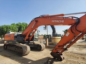Orange Hitachi ZX350 excavator on a construction site with trees heavy machinery for sale near corona ca by westrax machinery