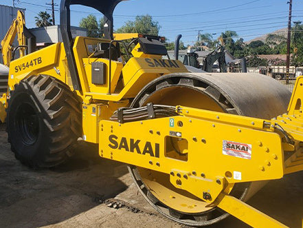 Yellow Sakai construction roller on a construction site heavy machinery for sale near Corona CA at Westrax Machinery